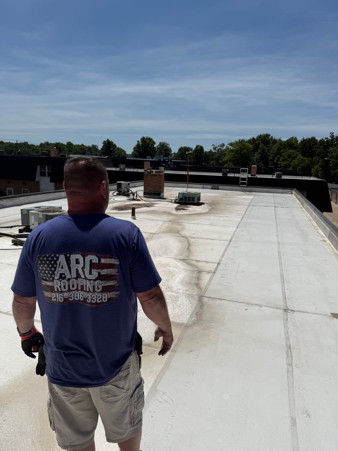 ARC Roofing worker on the roof