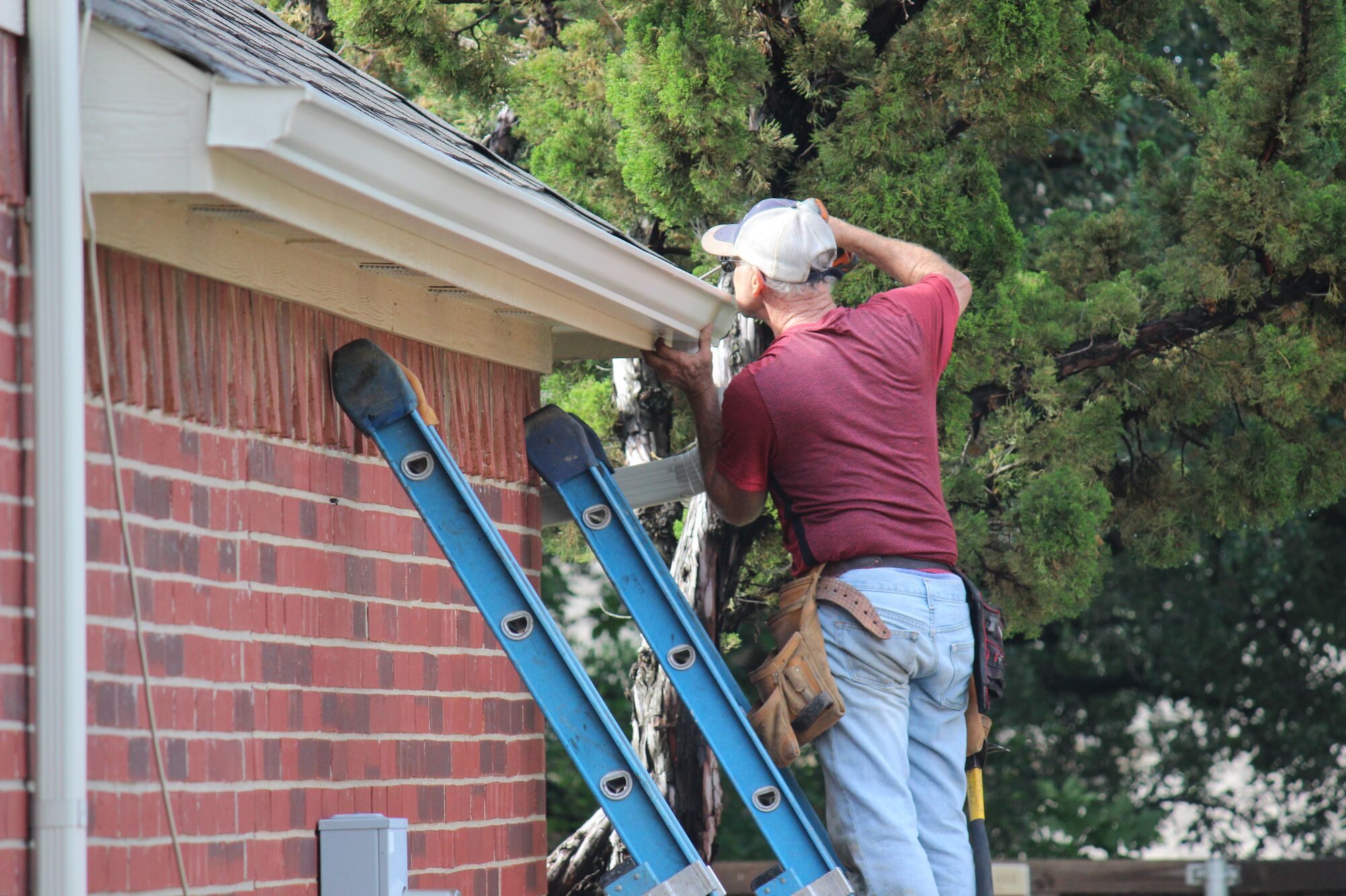 A man fixing gutter
