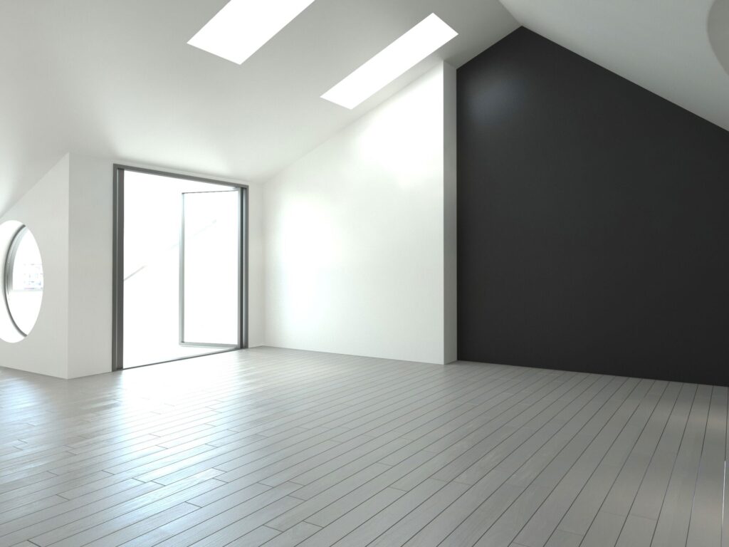 Bright, modern interior showcasing large windows, a round window, and a contrast of white and black walls. Ideal for design inspiration.