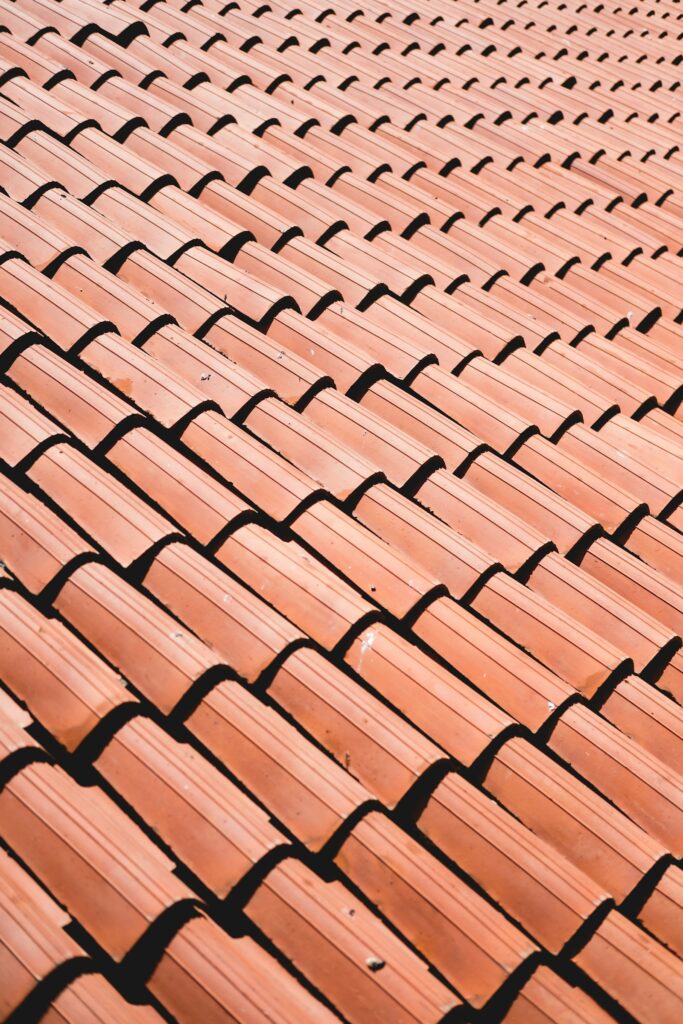Close-up of clay tile roof shingles on a Cleveland home in summer sunlight