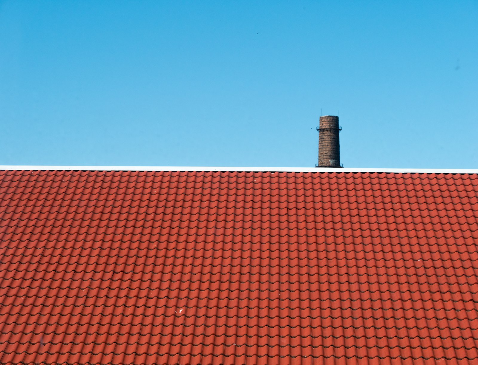 Brick chimney against a blue sky on a Cleveland-area home